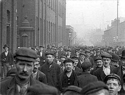 Men leaving a factory