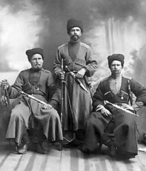Russian Cossacks displaying their attire and sabers.