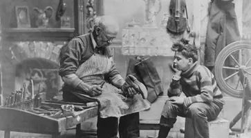 Archaic Occupation Terms Shoemaker Preparing Shoes For Young Boy Getty-Bettman Archives
