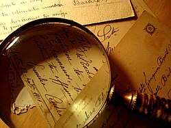 Magnifying glass and old documents